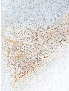 Bubbles from Eclat Soin Colour Care Shampoo with Betaine & Wheat Protein in a white backdrop